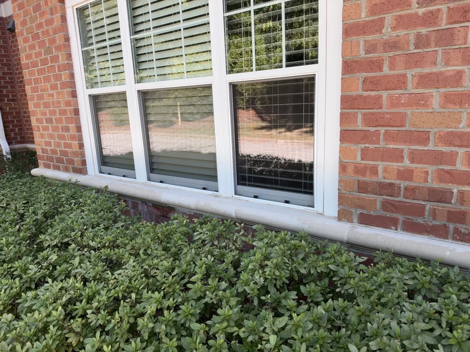 Same commercial windowsill and brick base clean after cleaning