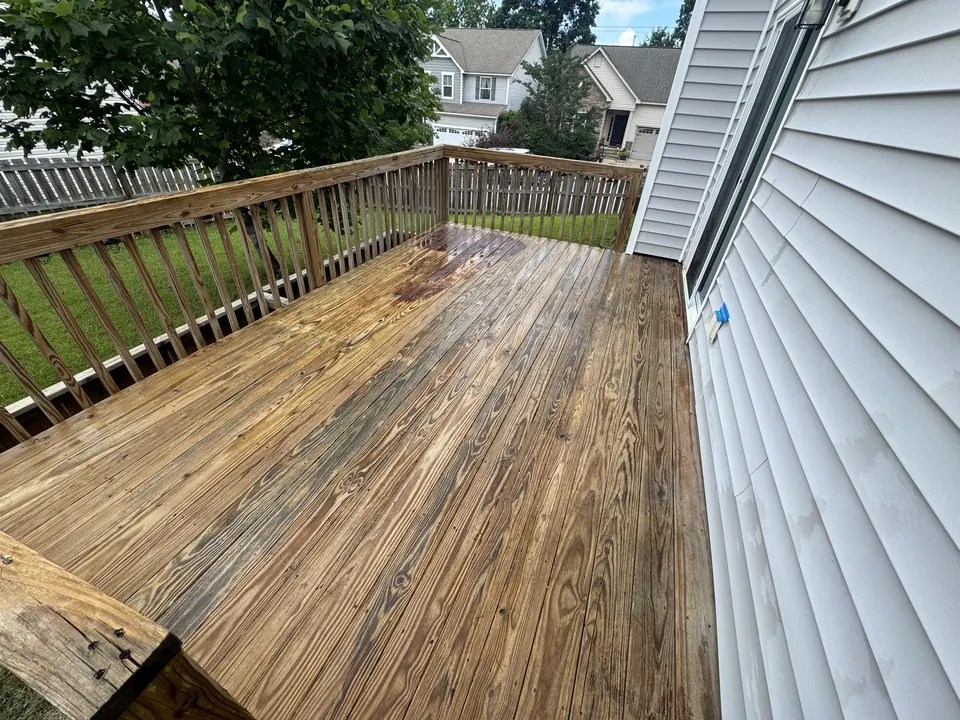 Wood deck with natural color restored after cleaning