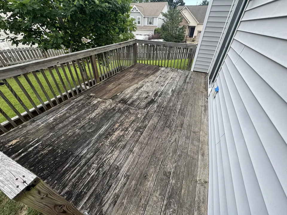 Gray weathered wood deck before cleaning