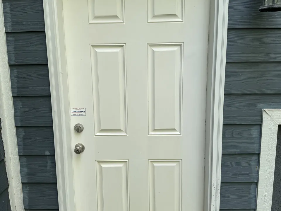 Same exterior door clean and white after cleaning