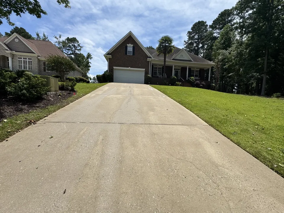 Light, clean concrete driveway after cleaning