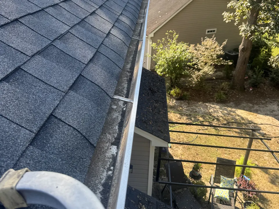 Same roof gutter clear of debris after clean-out