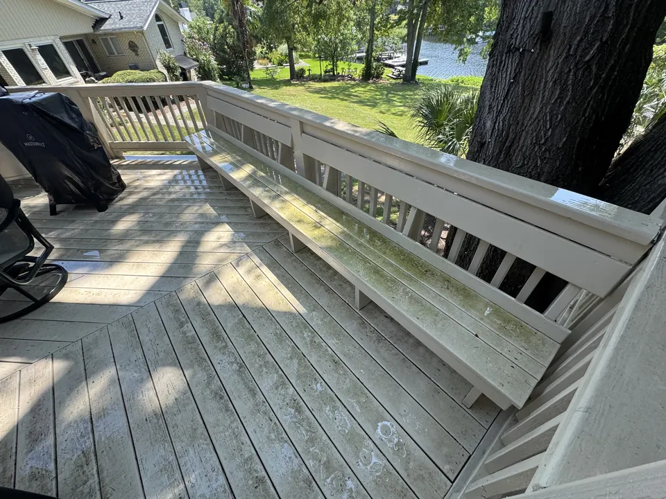 Dirty painted lakeside deck and bench before cleaning