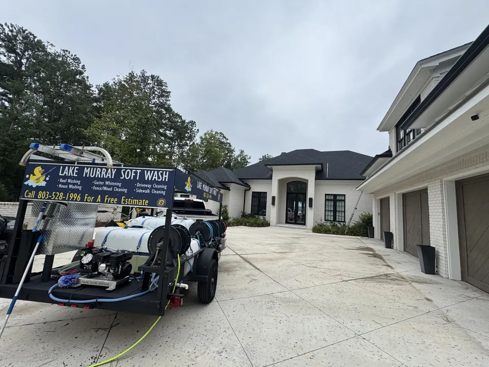 Lake Murray Soft Wash trailer parked at a large home